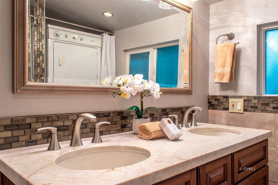 25341 Tahquitz Road Idyllwild, CA 92549 - Photo 38 of 56 a bathroom with a double vanity sink and a mirror