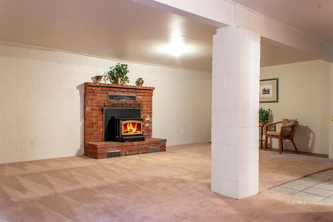 25341 Tahquitz Road Idyllwild, CA 92549 - Photo 42 of 56 a living room with furniture and a fireplace