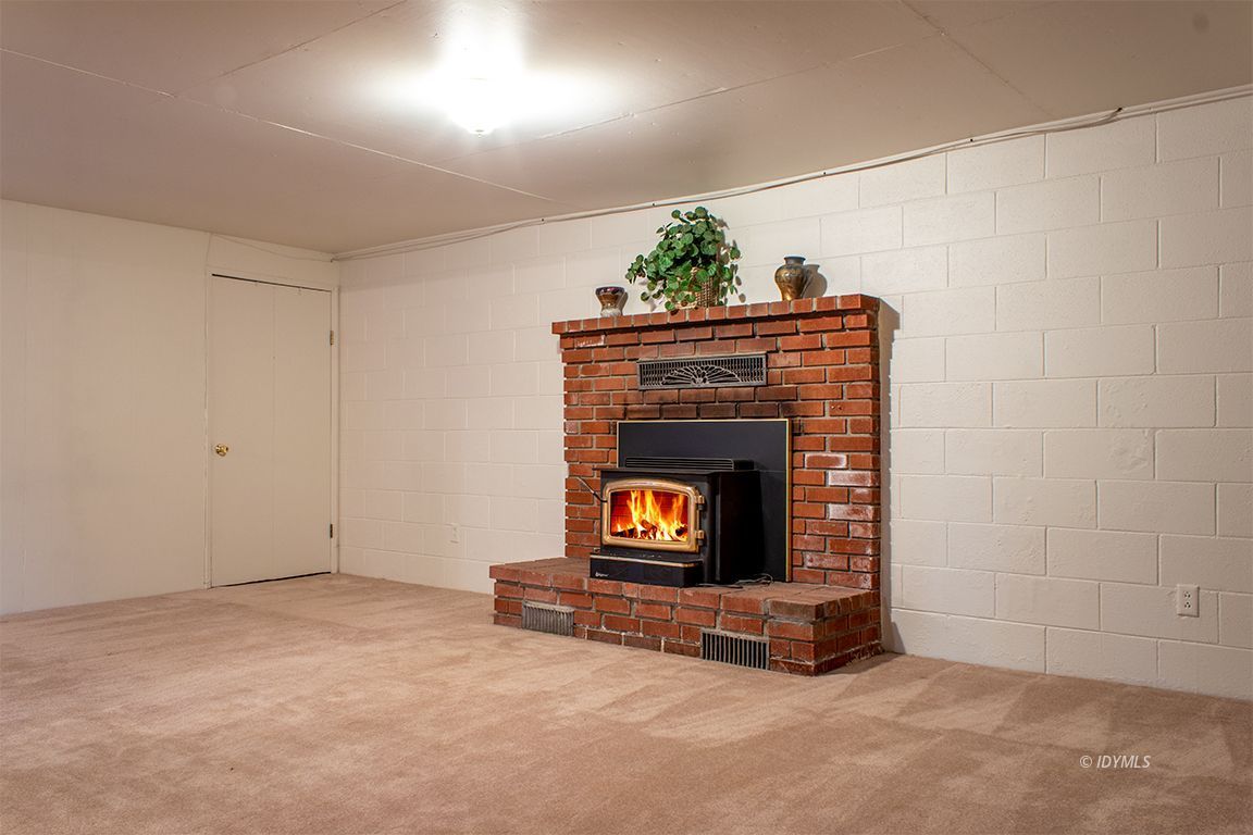 25341 Tahquitz Road Idyllwild, CA 92549 - Photo 45 of 56 a living room with furniture and a fireplace