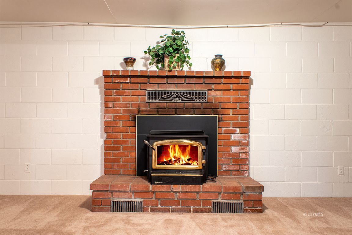 25341 Tahquitz Road Idyllwild, CA 92549 - Photo 46 of 56 a living room with furniture and a fireplace