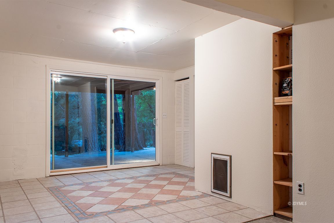 25341 Tahquitz Road Idyllwild, CA 92549 - Photo 49 of 56 a view of an empty room with window and a bathroom