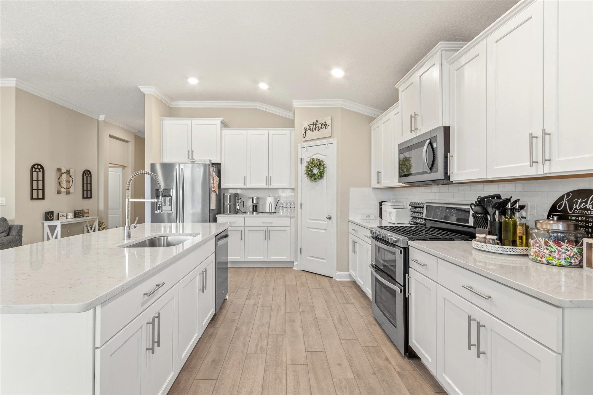 23 Alagon Way Street St. Augustine, FL 32084 - Photo 12 of 51 a kitchen with stainless steel appliances granite countertop a sink and cabinets