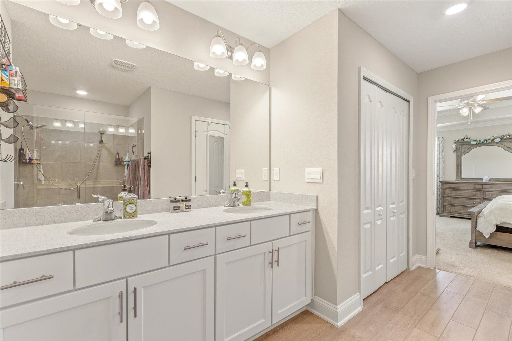 23 Alagon Way Street St. Augustine, FL 32084 - Photo 17 of 51 a en suite bathroom with double sink and a mirror