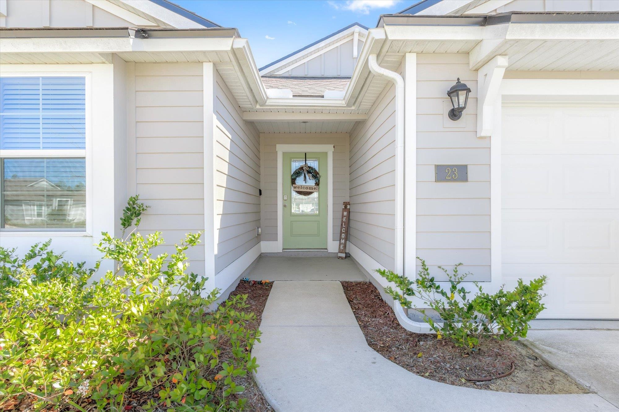 23 Alagon Way Street St. Augustine, FL 32084 - Photo 2 of 51 a view of a pathway with flower pots