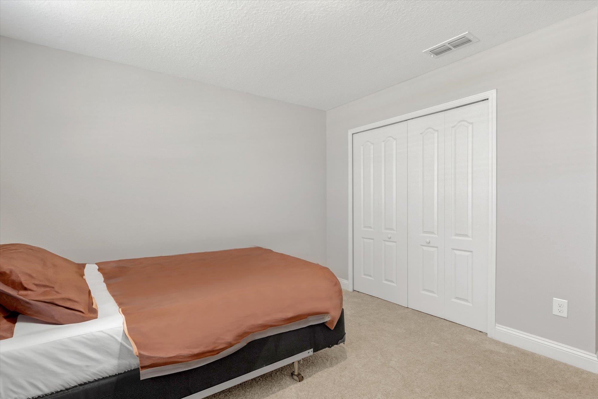 23 Alagon Way Street St. Augustine, FL 32084 - Photo 21 of 51 a room with a bed and a couch