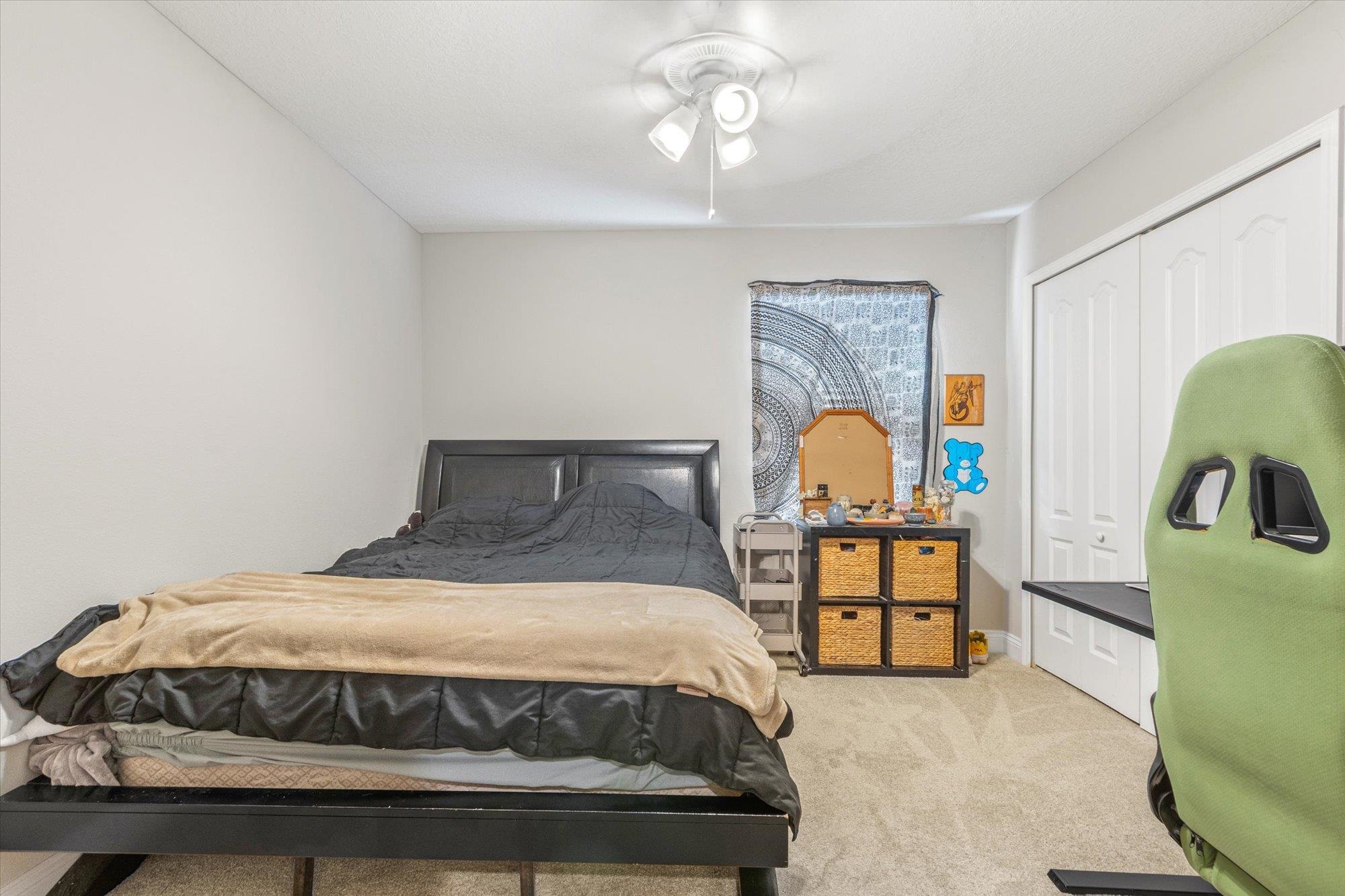 23 Alagon Way Street St. Augustine, FL 32084 - Photo 24 of 51 a bed sitting in a bedroom next to a window