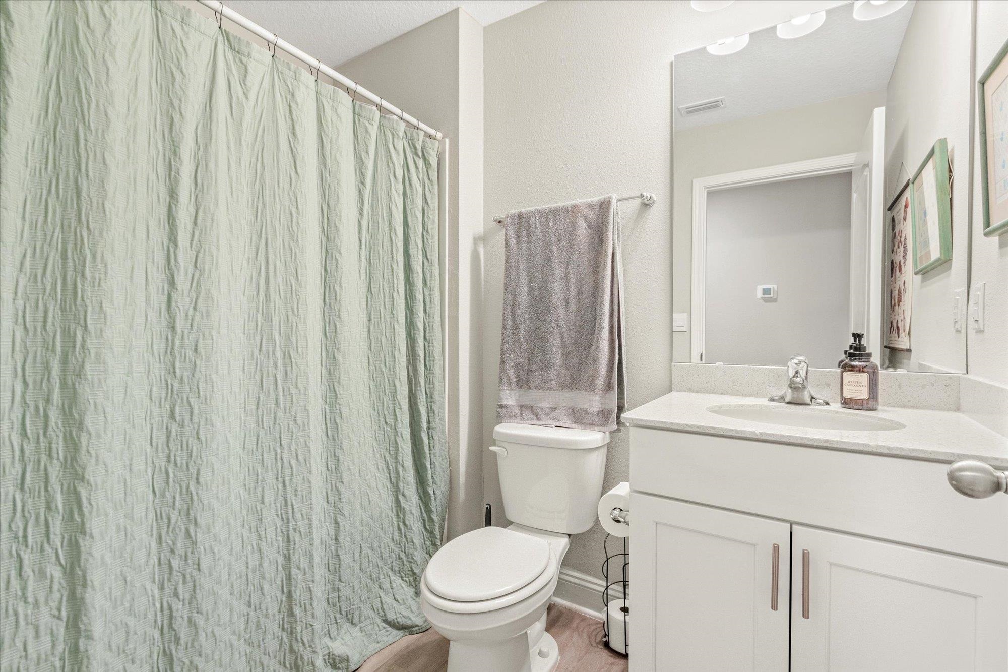 23 Alagon Way Street St. Augustine, FL 32084 - Photo 25 of 51 a bathroom with a toilet a sink and a mirror
