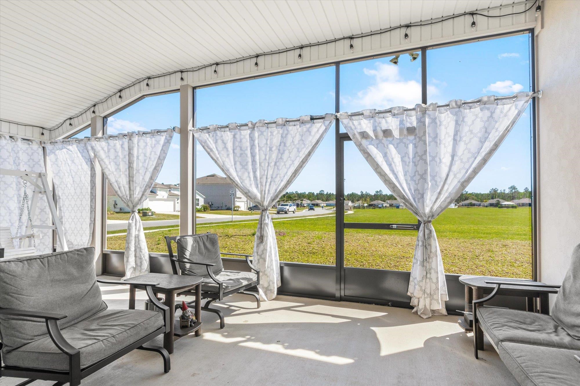 23 Alagon Way Street St. Augustine, FL 32084 - Photo 26 of 51 a view of living room with furniture and floor to ceiling window