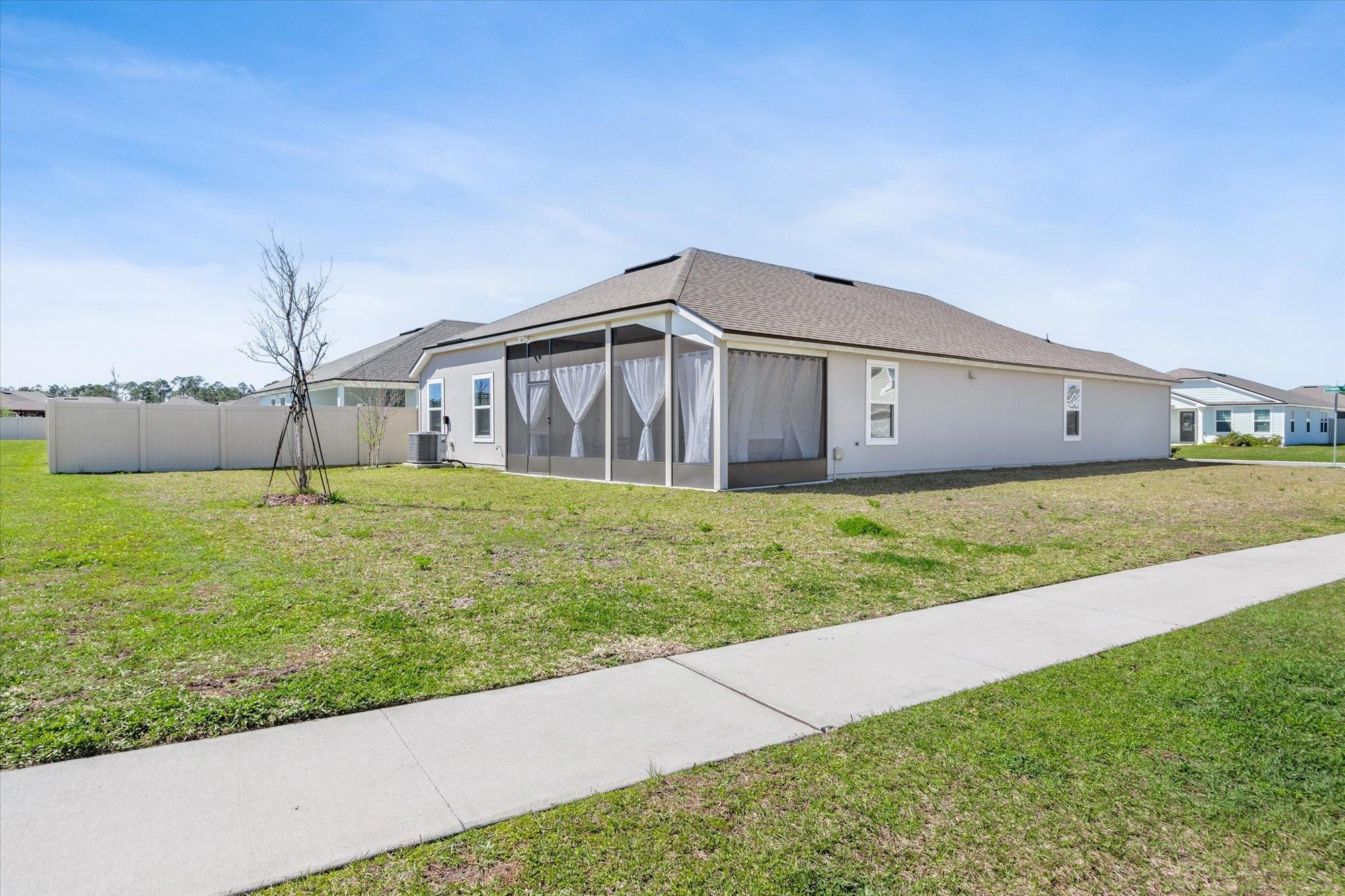 23 Alagon Way Street St. Augustine, FL 32084 - Photo 32 of 51 a big house with a big yard and large trees