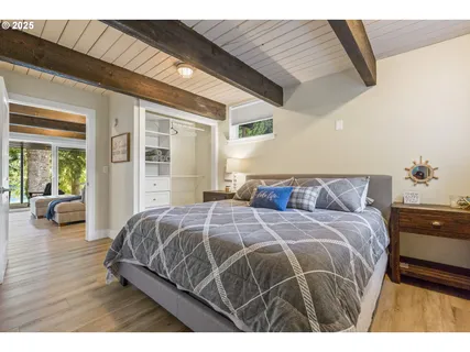 a bedroom with a large bed and a couch