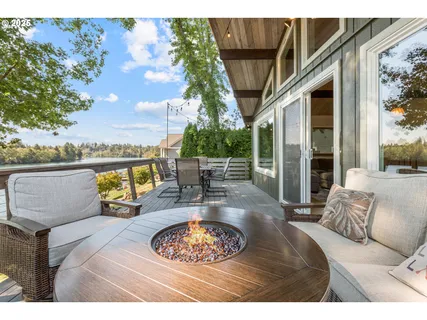 a view of living room with patio furniture and a swimming pool