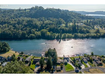 an aerial view of a house with a yard