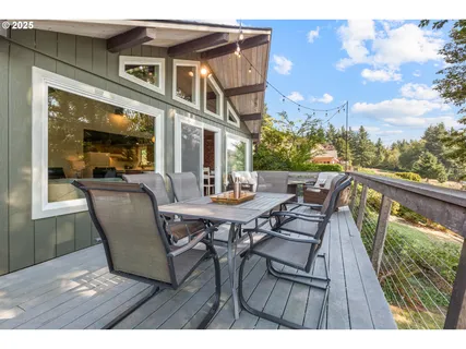 a view of a patio with table and chairs