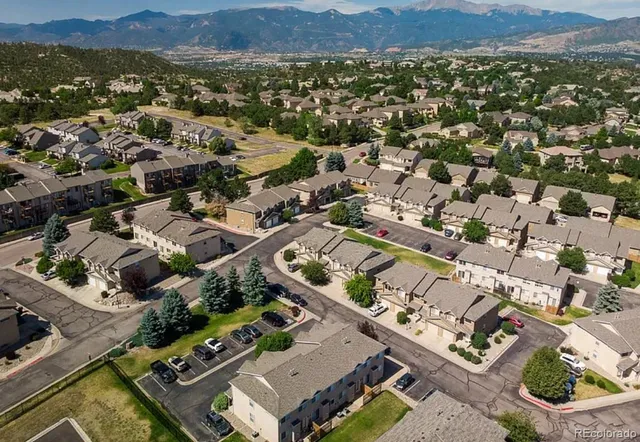 an aerial view of residential houses with outdoor space