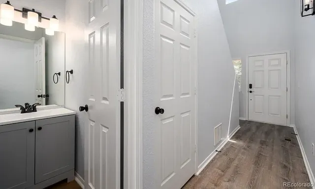 a view of a bathroom with a sink and mirror
