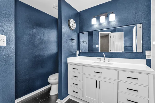 a bathroom with a double vanity sink mirror and double