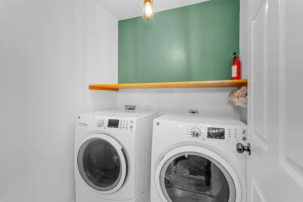 a utility room with dryer and washer