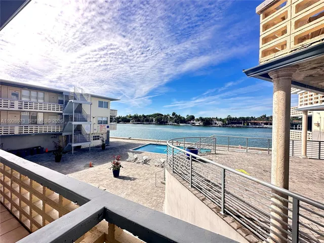 a spacious bedroom with a bed and a couch