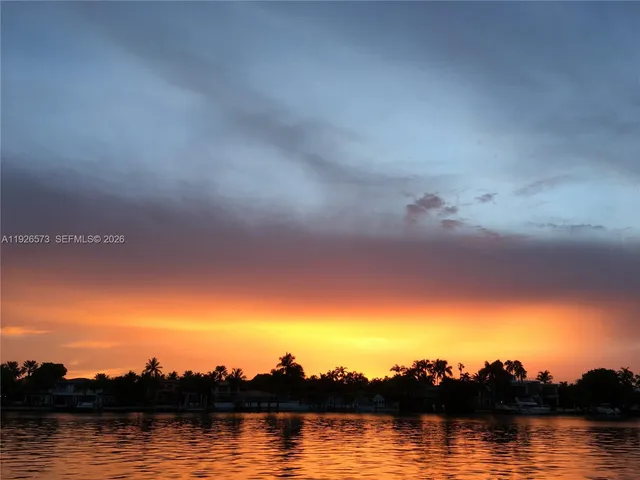 a bedroom with a bed and flat screen tv