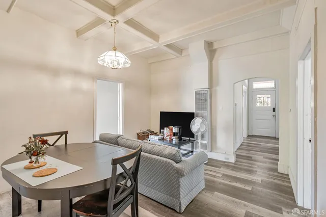 a view of a livingroom with furniture and a table