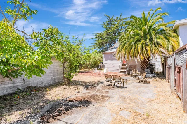 a view of a backyard of a house