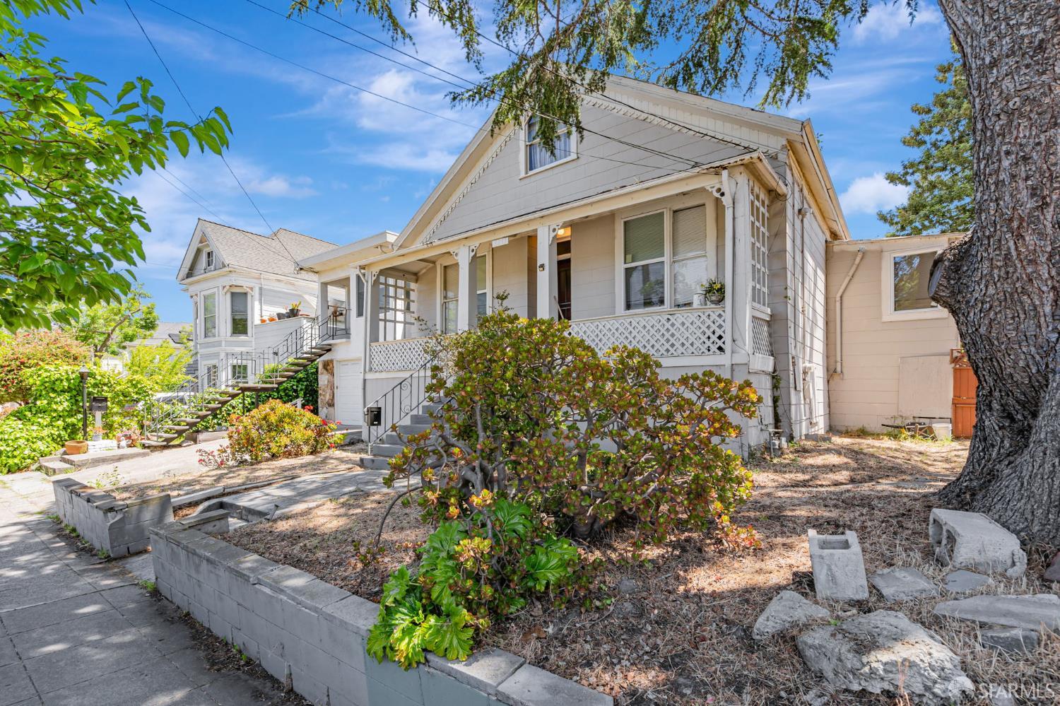 3233 Ellis Street Berkeley, CA 94703 - Photo 4 of 31 a front view of a house with garden
