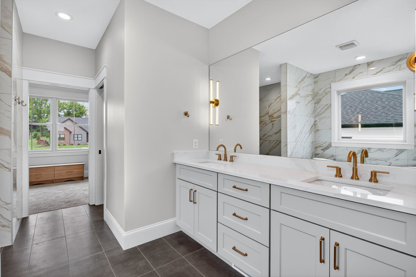 6928 Wilderness Pointe Bettendorf, IA 52722 - Photo 30 of 48 a bathroom with a sink a double vanity and a mirror