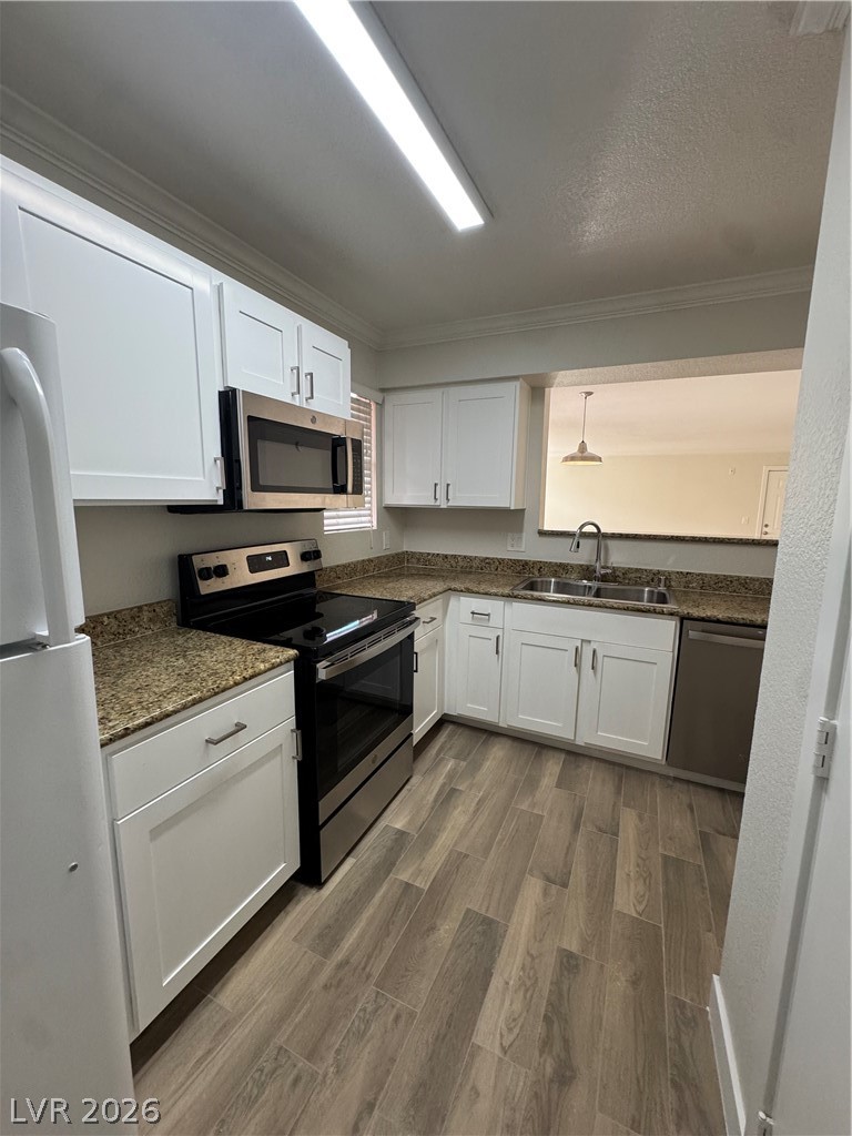 8101 West Flamingo Road, Unit 1040 Las Vegas, NV 89147 - Photo 6 of 22 This spacious kitchen offers ample cabinet storage and a practical layout for daily living.