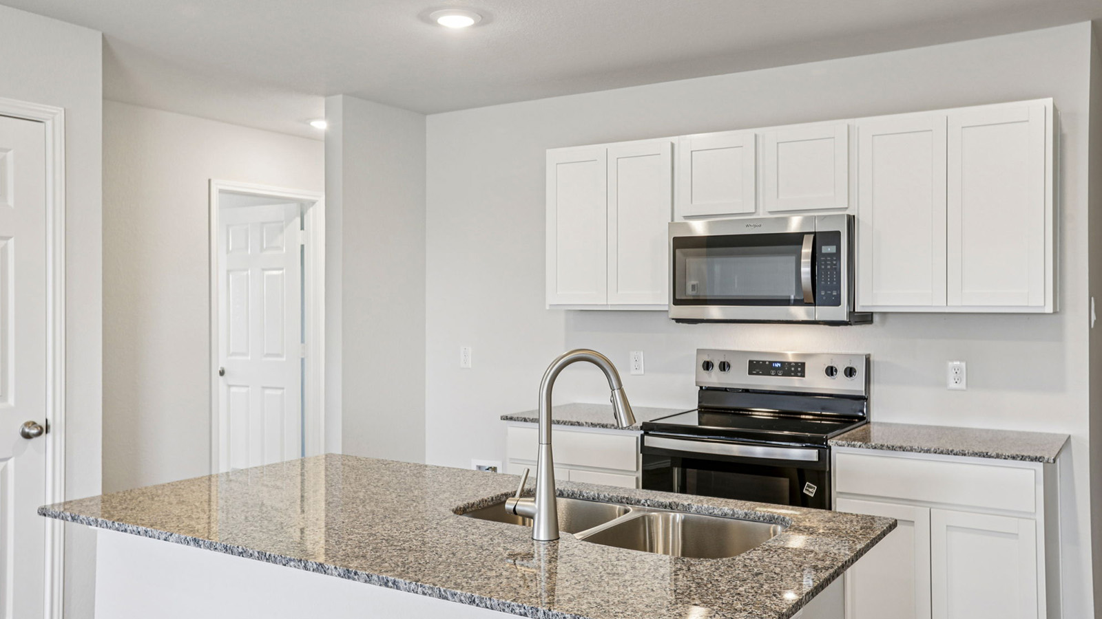 148 Wyatt Way Jarrell, TX 76537 - Photo 4 of 33 Kitchen island with double basin sink and gooseneck faucet