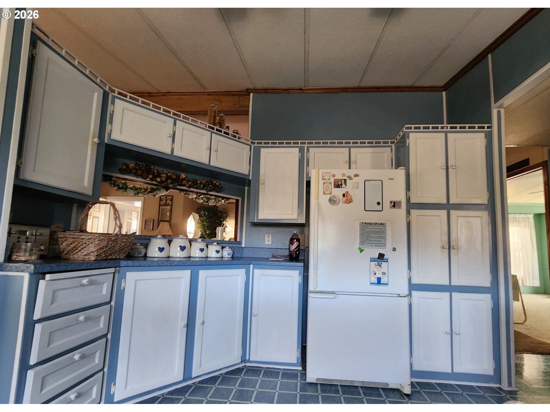 5422 Portland Road Northeast Salem, OR 97305 - Photo 6 of 14 a kitchen with stainless steel appliances a refrigerator and cabinets