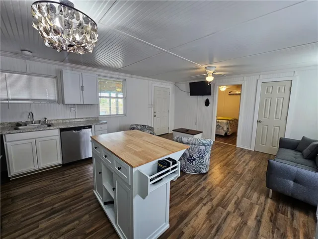 a kitchen that has a lot of cabinets in it