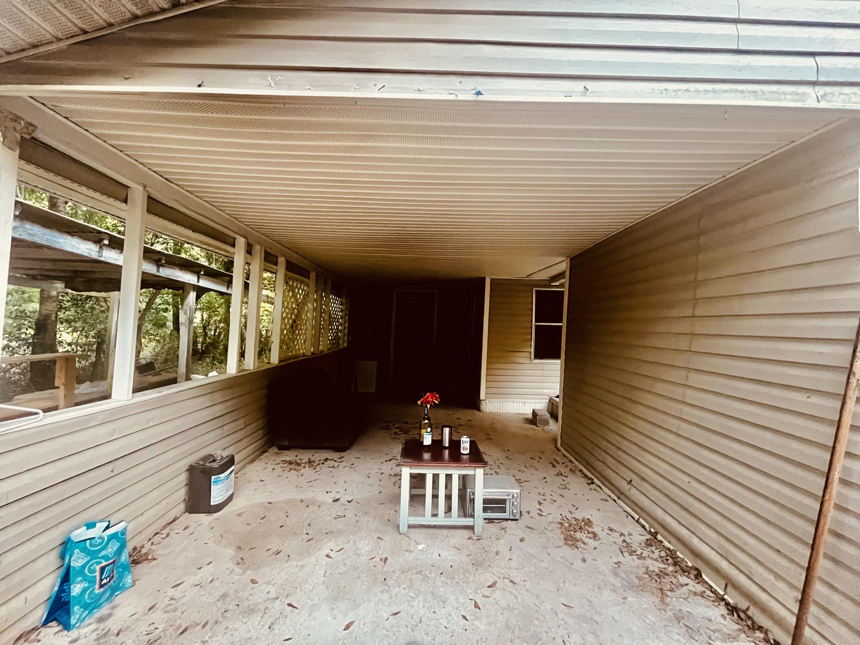 3040 Register Lane Crestview, FL 32539 - Photo 4 of 13 a front view of a house with outdoor seating