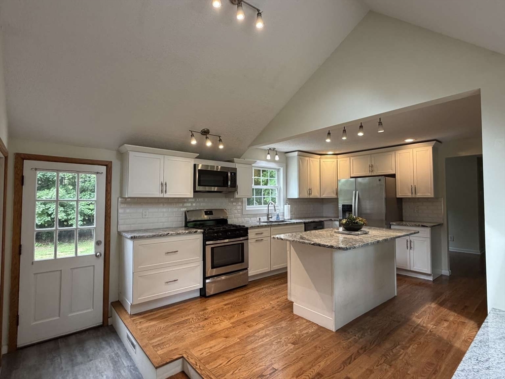 74 Birch Road Longmeadow, MA 01106 - Photo 3 of 38 a kitchen with stainless steel appliances a stove top oven a sink dishwasher and a refrigerator