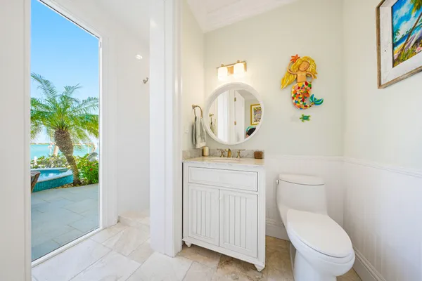 a bedroom with a large bed and a large window