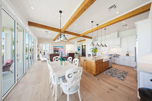 a view of a lake with couches in the patio