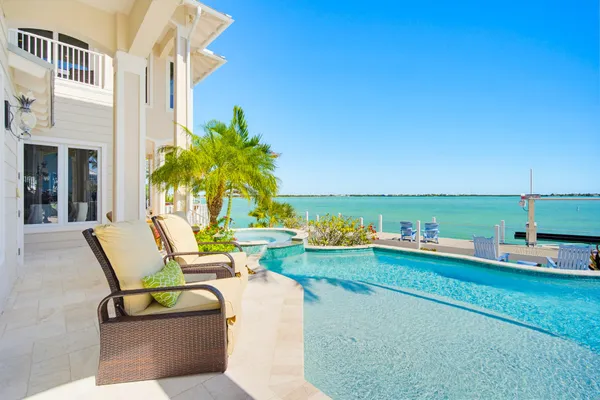 a black and white photo of a white refrigerator