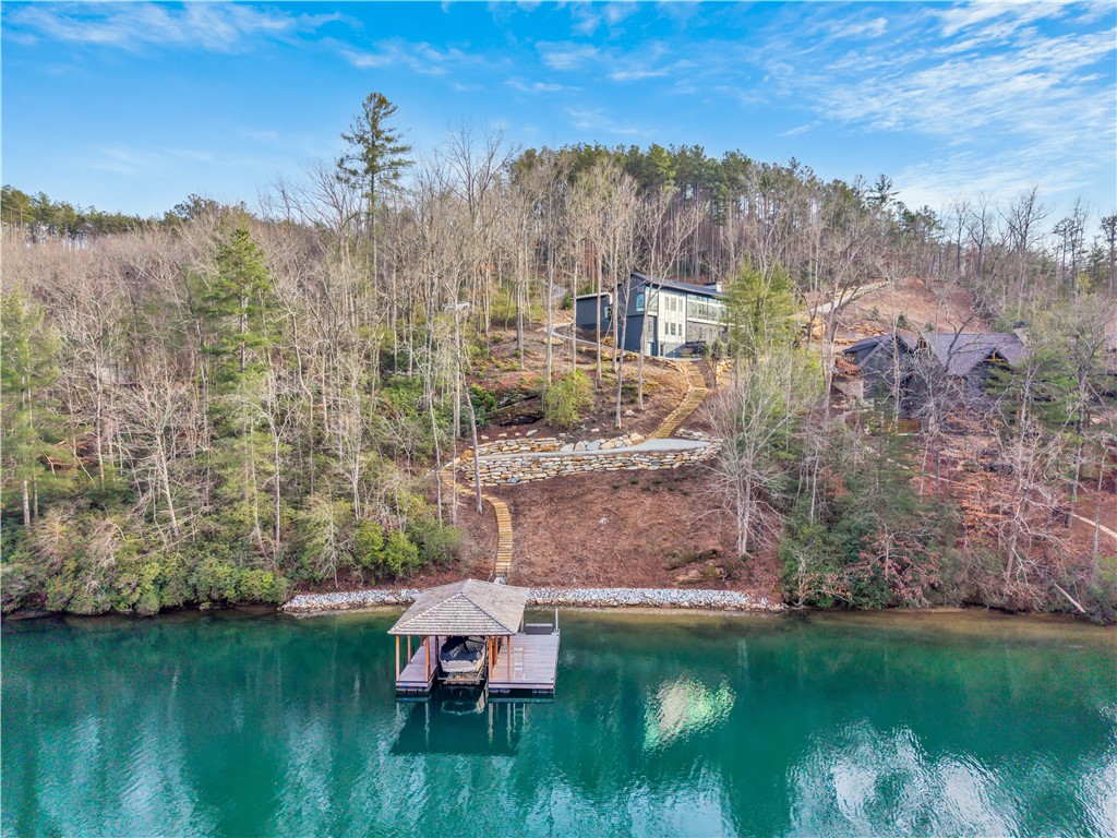 127 Crosswind Court Sunset, SC 29685 - Photo 2 of 49 This serene lakefront residence offers direct water access and picturesque surroundings.