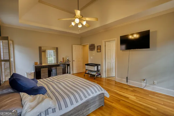 a bedroom with a large bed and a window