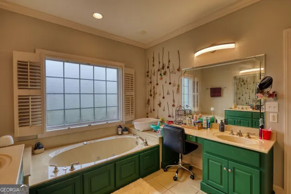 a bathroom with a sink mirror and shower