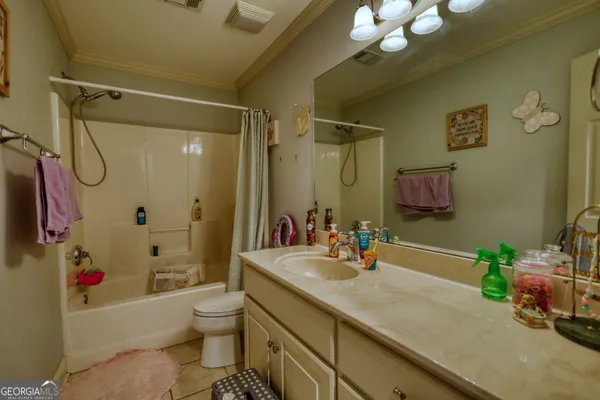 a room with furniture and a flat screen tv