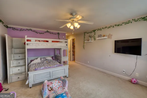 a bedroom with furniture and a window