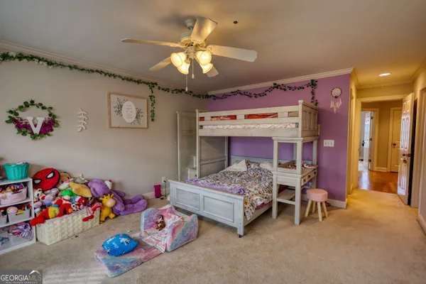 a view of a room with furniture and cars