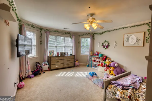 a room with gym equipment and a large window
