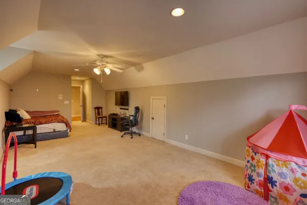 a view of a patio with couches table and chairs and potted plants