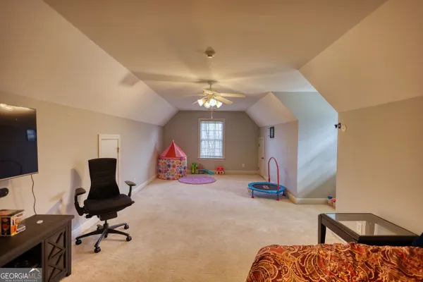 a living room with furniture and windows