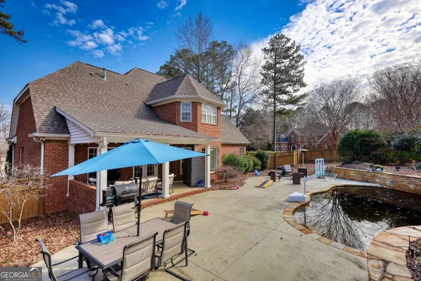 a view of swimming pool with a patio