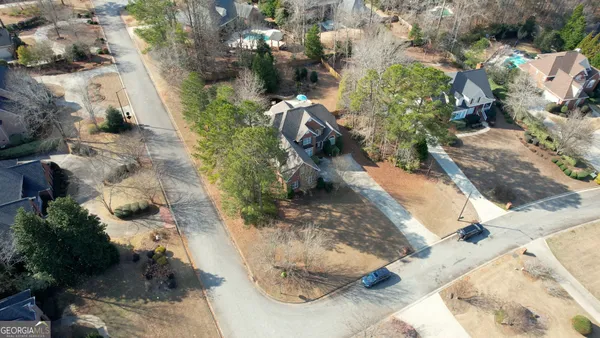 an aerial view of residential houses with outdoor space