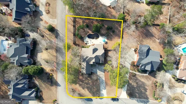 an aerial view of residential houses with outdoor space
