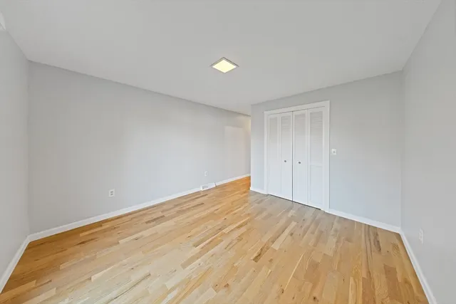 a bathroom with a double vanity sink and mirror with shower