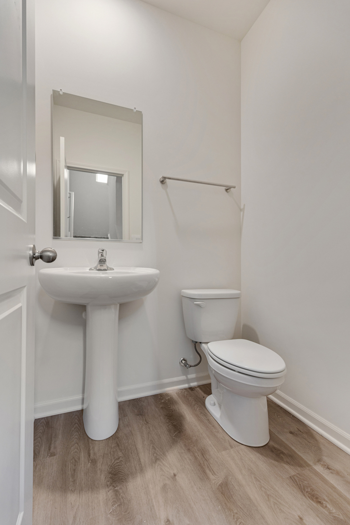 2016 Yellowstone Boulevard Mundelein, IL 60060 - Photo 13 of 26 a bathroom with a sink toilet and a mirror